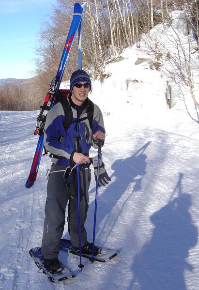 File:Snowshoer packing skis.jpg